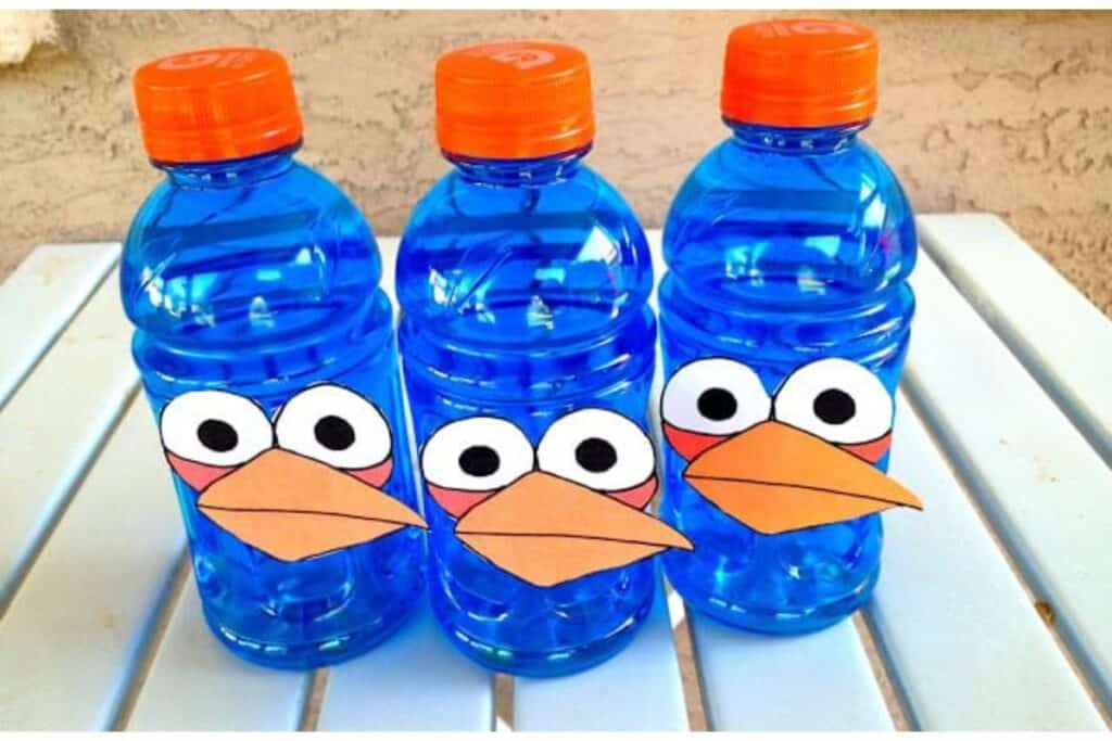 Blue Gatorade bottles decorated to look like blue birds from Angry Birds for Angry Birds birthday party foods