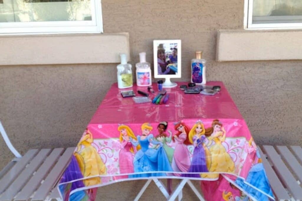 A princess table set up with great smelling lotions and makeup for the girls to use as part of the princess birthday party activities.