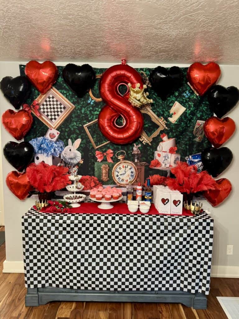 Front view of the food and decorations table - Descendants "Rise of Red" party