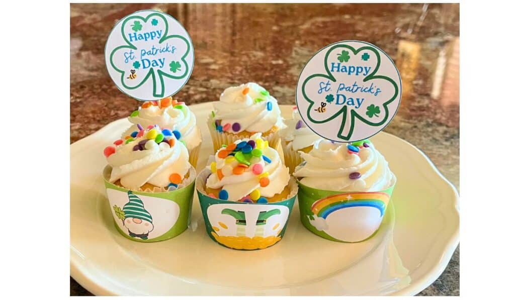 Mini cupcakes decorated with St. Patrick's day cupcake wrappers and cupcake toppers