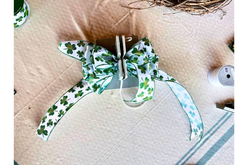 using a bowdabra to make a large beautiful bow for my st. Patrick's day wreath