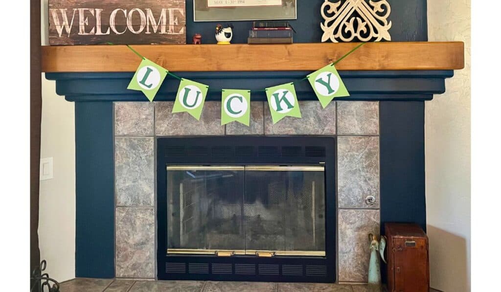 St. Patrick's day banner that says lucky, hung on mantel of fireplace