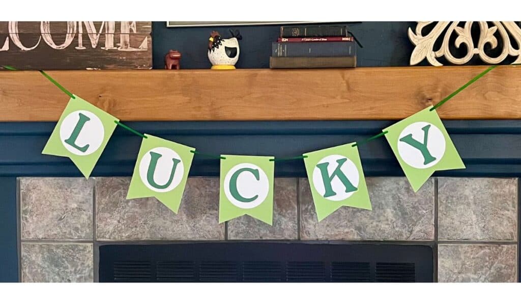 st. patrick's day banner on fireplace mantel that says lucky