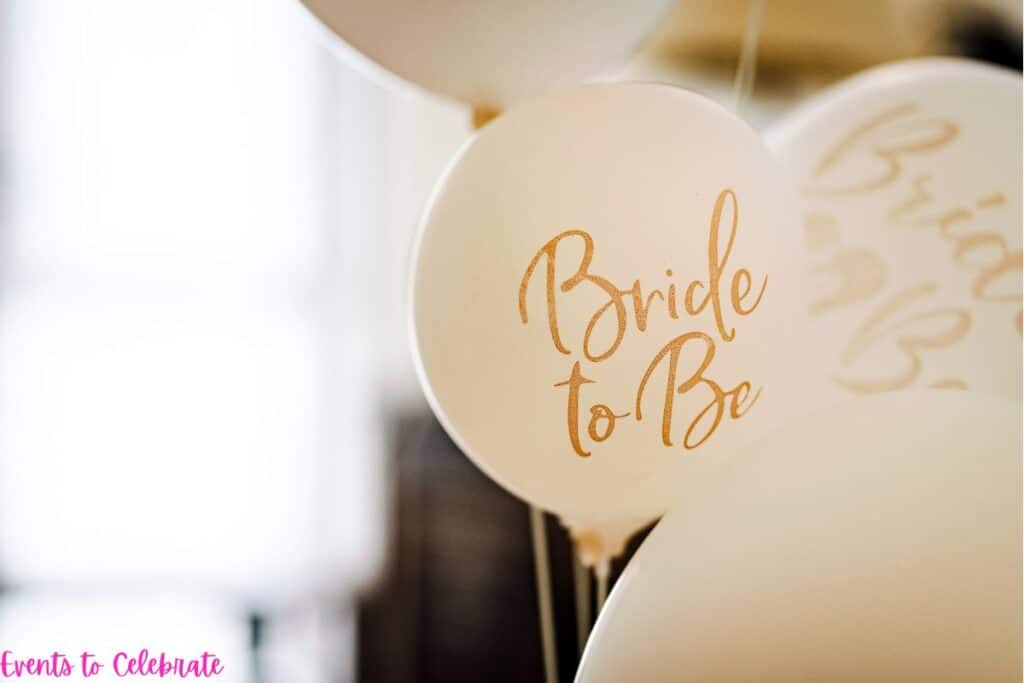 white balloons that say bride to be on them