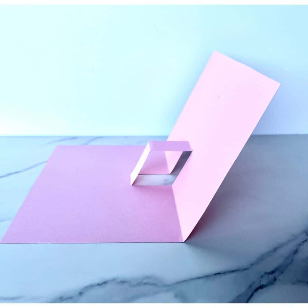 This image shows the pop up mechanism folded properly in order to make this pop-up card.