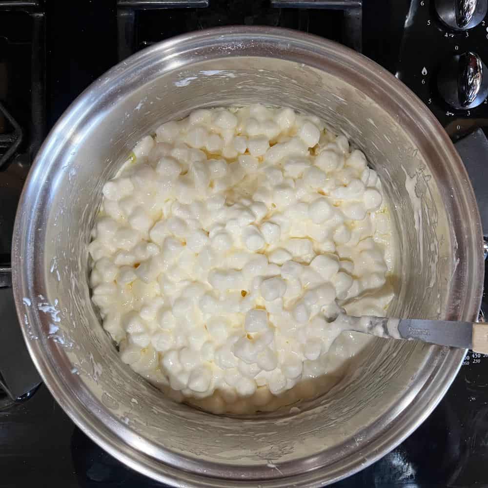 Melting marshmallows to make unicorn Rice Krispie treats